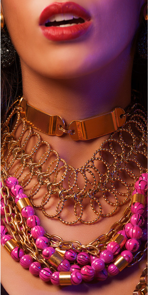 A close-up of a woman covered in accessories from designer Laruicci.